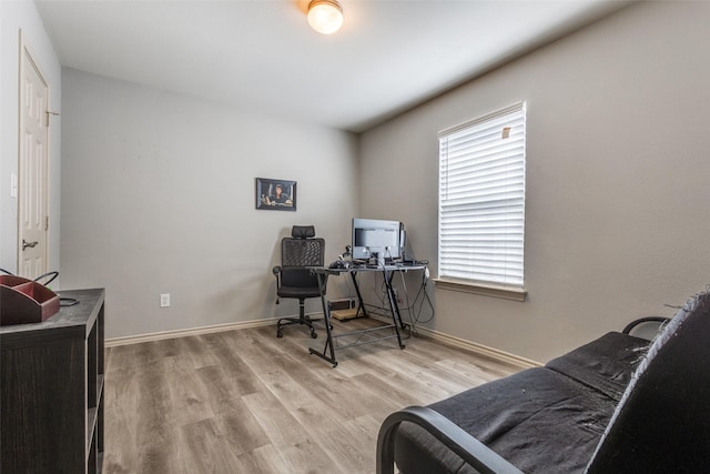 office with baseboards and wood finished floors