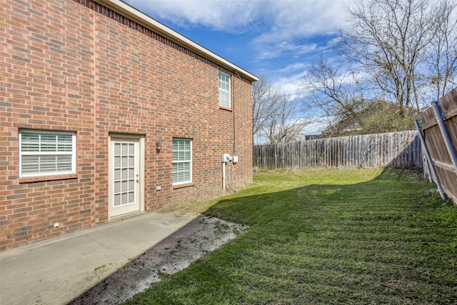 view of yard with a patio area and a fenced backyard