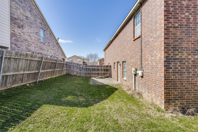 view of yard with a fenced backyard