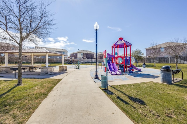 community playground featuring a yard, a gazebo, and fence