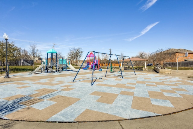 communal playground featuring fence