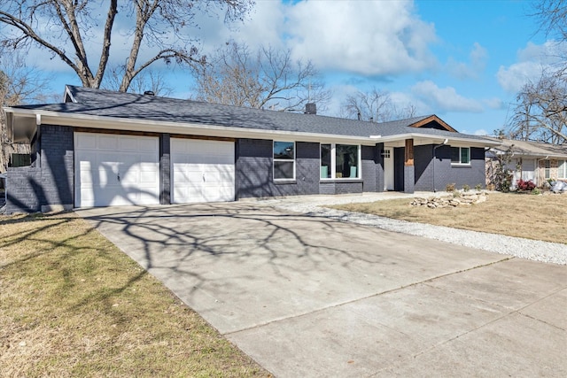 ranch-style house with a front lawn, brick siding, and an attached garage