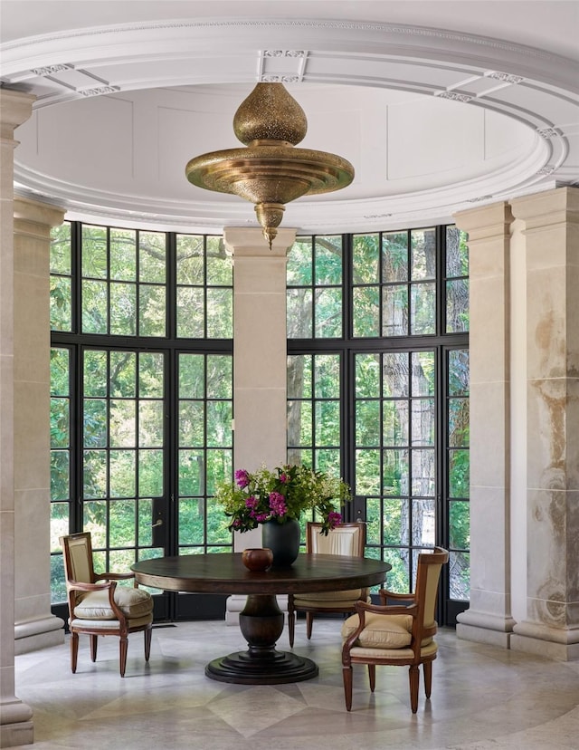 sunroom featuring ornate columns