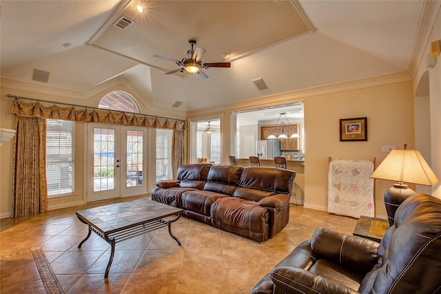 living area with lofted ceiling, french doors, a ceiling fan, and baseboards