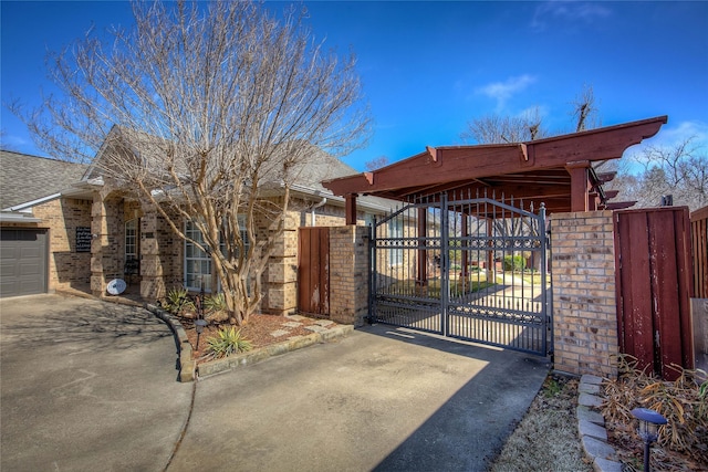 view of gate with fence