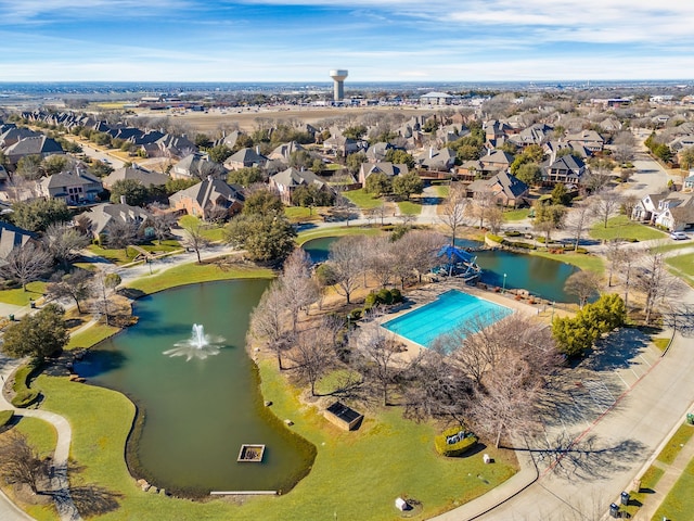 bird's eye view featuring a residential view and a water view