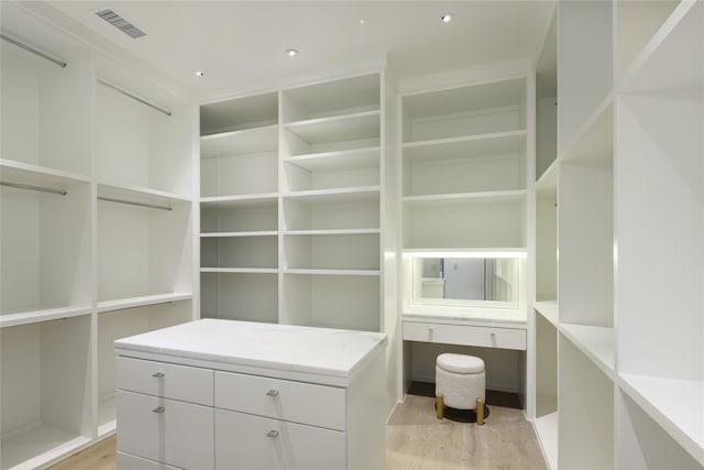 spacious closet featuring light wood finished floors and visible vents