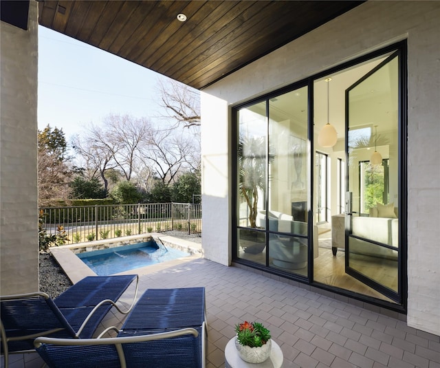 view of patio / terrace featuring a fenced in pool and fence