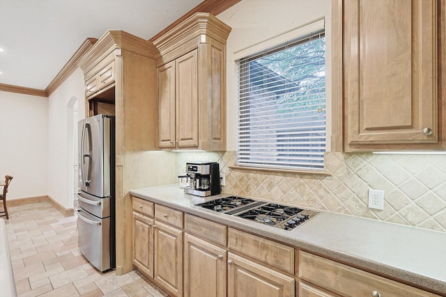 kitchen featuring crown molding, stainless steel appliances, light countertops, backsplash, and light brown cabinets