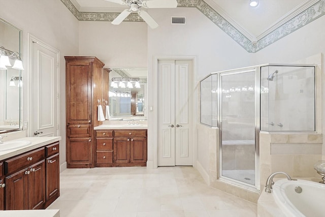 bathroom featuring vanity, visible vents, ornamental molding, a shower stall, and a bath