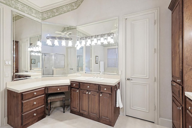 bathroom with ornamental molding, a shower stall, and vanity