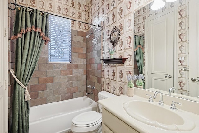 full bath with vanity, shower / bath combo with shower curtain, toilet, and wallpapered walls