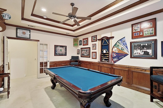 playroom with light colored carpet, visible vents, ornamental molding, wainscoting, and a tray ceiling