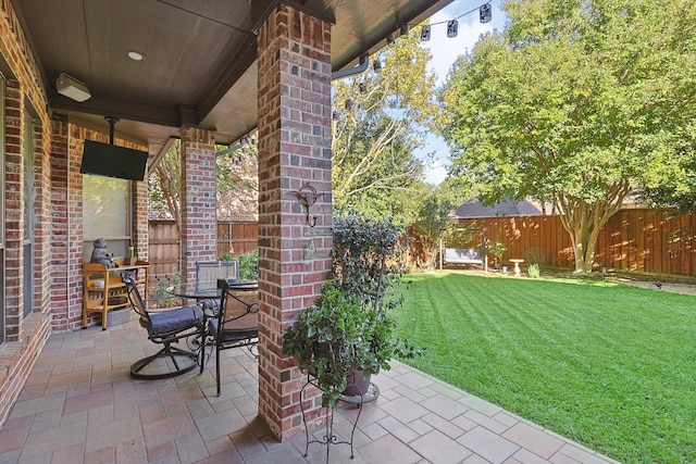 view of patio / terrace with outdoor dining area and a fenced backyard