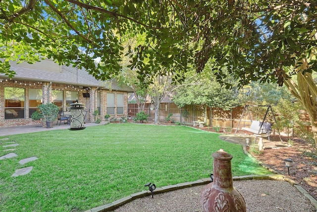 view of yard with a patio area and a fenced backyard