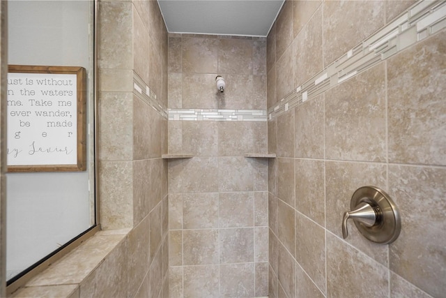 bathroom with tiled shower