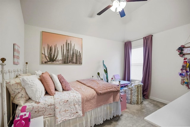 carpeted bedroom with vaulted ceiling and ceiling fan