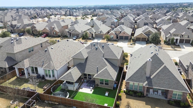 birds eye view of property with a residential view