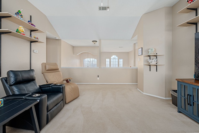 sitting room featuring visible vents, light carpet, and baseboards