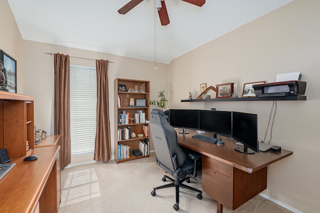 office area featuring ceiling fan, carpet floors, and baseboards