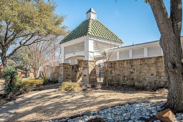 exterior space featuring stone siding