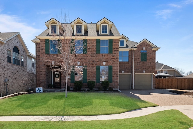 view of front of home with a front lawn, brick siding, driveway, and an attached garage