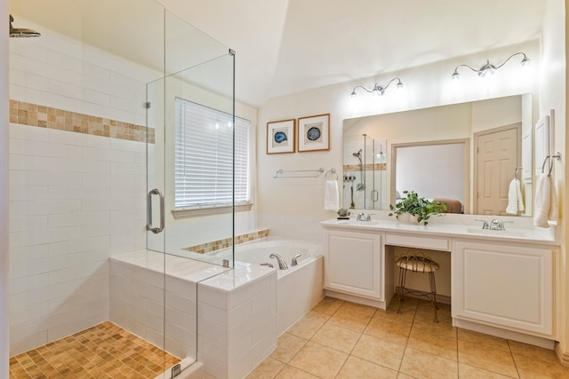 full bathroom with double vanity, a stall shower, a sink, a bath, and tile patterned floors