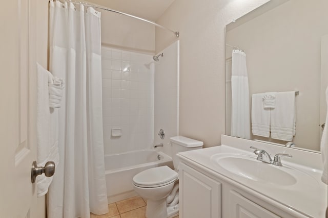 bathroom with shower / bath combo, vanity, toilet, and tile patterned floors