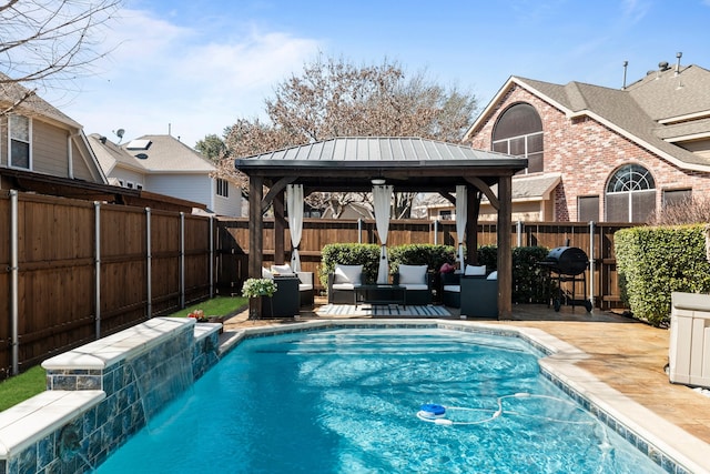 view of pool featuring a gazebo, a patio, a fenced backyard, and a fenced in pool