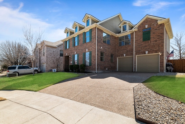 view of front facade with driveway, brick siding, an attached garage, fence, and a front yard