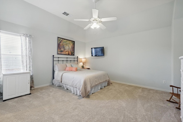 bedroom with baseboards, a ceiling fan, visible vents, and light colored carpet