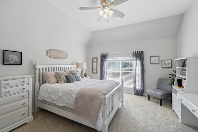 bedroom with lofted ceiling, light colored carpet, ceiling fan, and baseboards