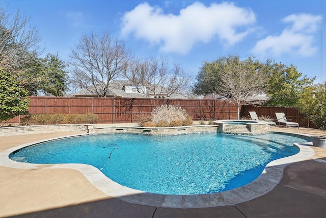 view of pool with a fenced backyard, a pool with connected hot tub, and a patio