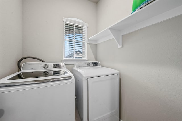 laundry area featuring laundry area and washing machine and clothes dryer