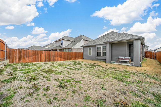 view of yard with a patio area and a fenced backyard