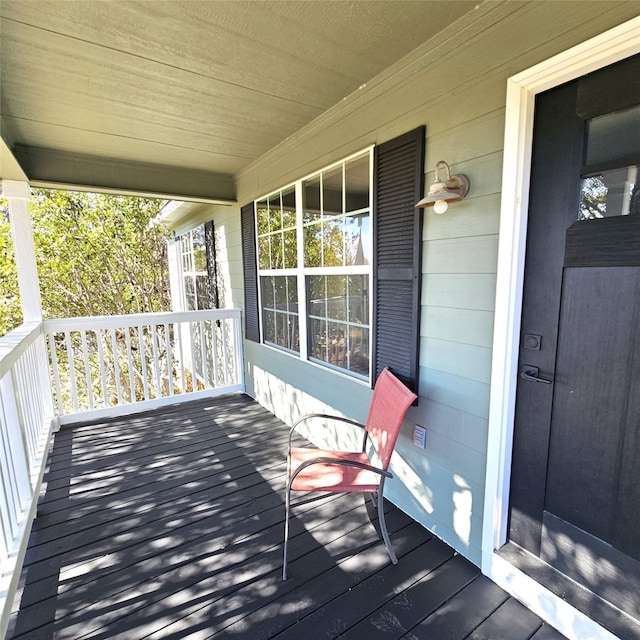 wooden deck featuring a porch