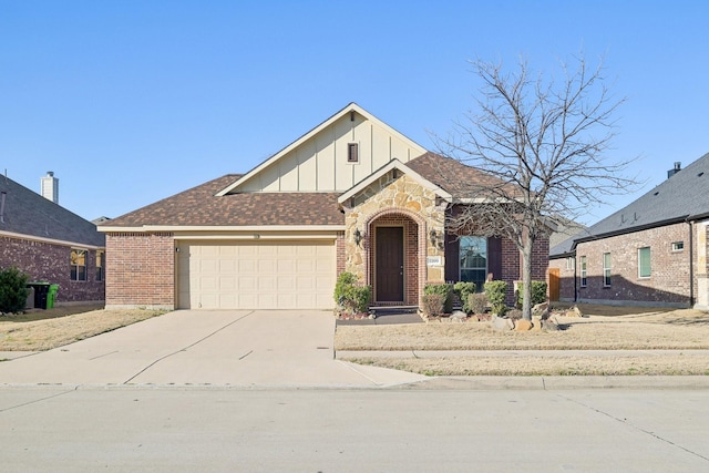 view of front of property with driveway, a garage, roof with shingles, board and batten siding, and brick siding