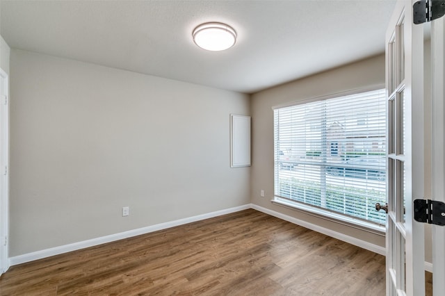 5700 Giddyup Ln, Fort Worth, TX 76179 - unfurnished room featuring wood finished floors and baseboards