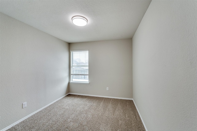 5700 Giddyup Ln, Fort Worth, TX 76179 - empty room featuring carpet, baseboards, and a textured ceiling