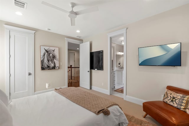 carpeted bedroom with baseboards, visible vents, a ceiling fan, ensuite bathroom, and recessed lighting