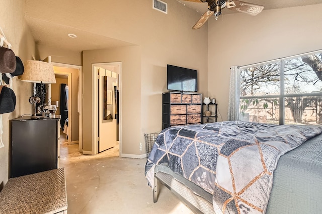 bedroom with concrete flooring, ceiling fan, a towering ceiling, visible vents, and baseboards