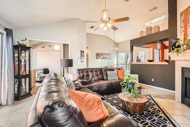 living room featuring a fireplace with flush hearth, lofted ceiling, visible vents, and a textured ceiling