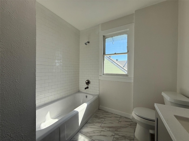 bathroom featuring toilet, vanity, bathing tub / shower combination, baseboards, and marble finish floor