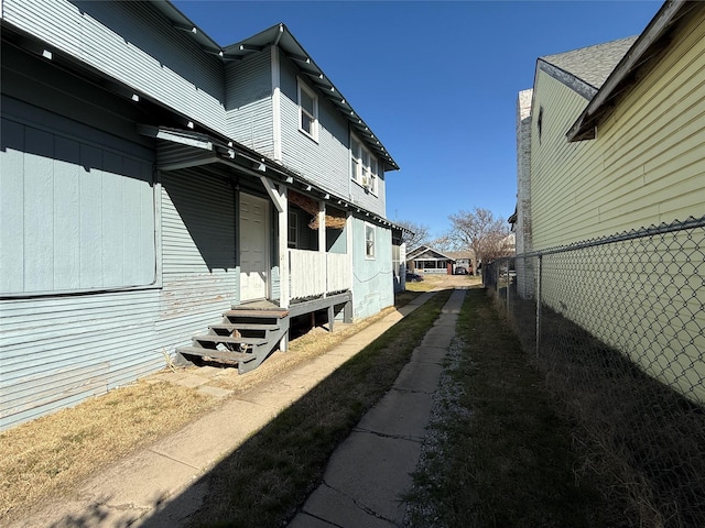 view of property exterior with fence