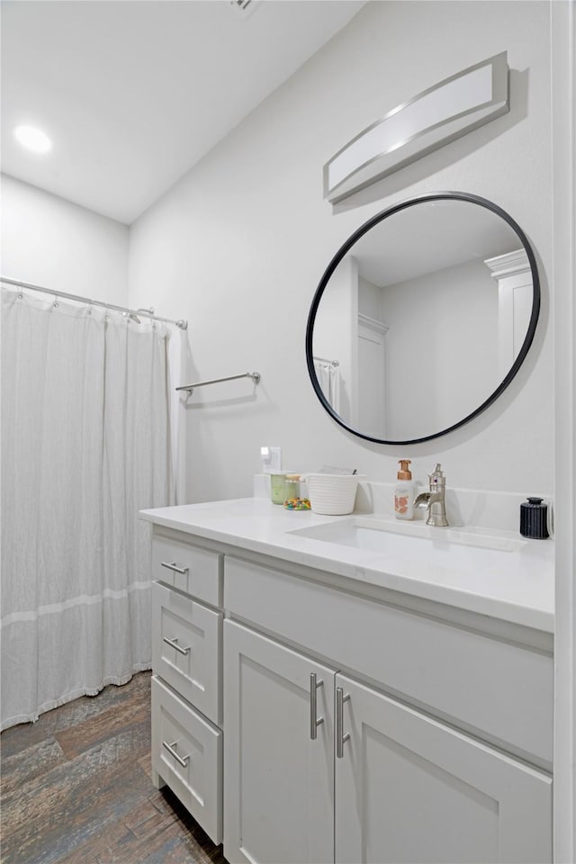 full bath featuring wood finished floors and vanity