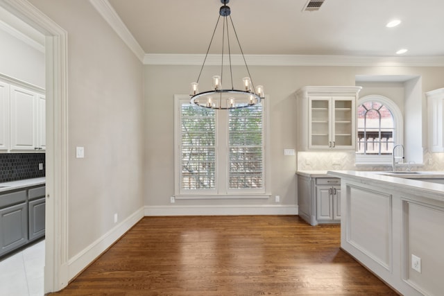 kitchen with white cabinets, glass insert cabinets, and gray cabinets