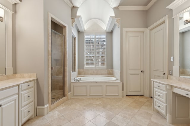 full bath with a stall shower, a garden tub, tile patterned flooring, crown molding, and vanity