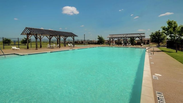 pool featuring fence, a pergola, and a gazebo