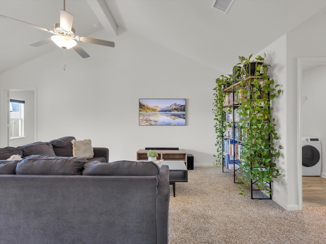 living room featuring vaulted ceiling with beams, washer / dryer, light carpet, and visible vents