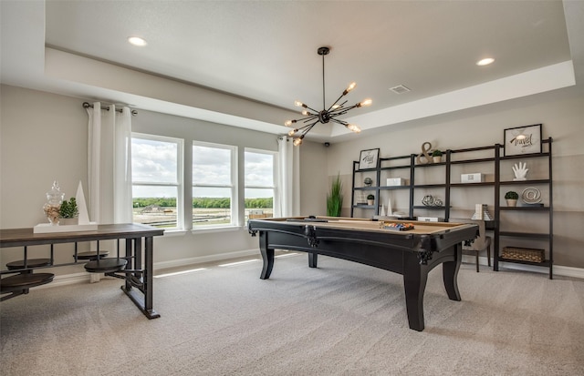 rec room featuring recessed lighting, a raised ceiling, light colored carpet, and baseboards